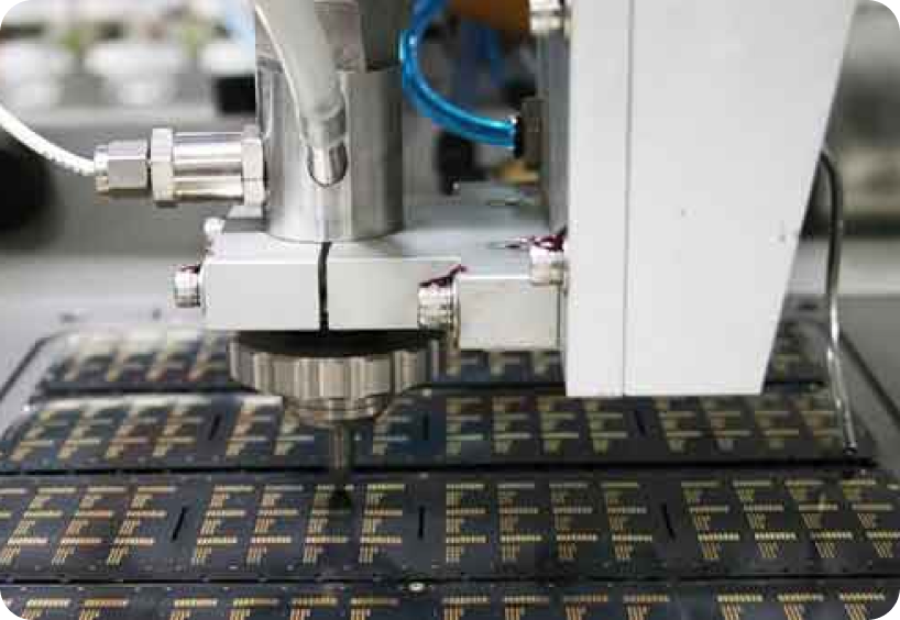 Close-up of waterjet cutting circuit board. Flow offers custom machining solutions around our Mach series product line.
