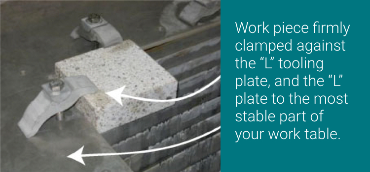 Fixture-Well,-And-Often-workpiece.jpg small stone workpiece securely fixtured to the slats of a waterjet table