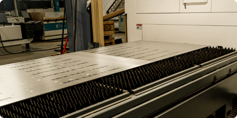 view of the shuttle table of the LZR fiber laser at JQ Enterprises