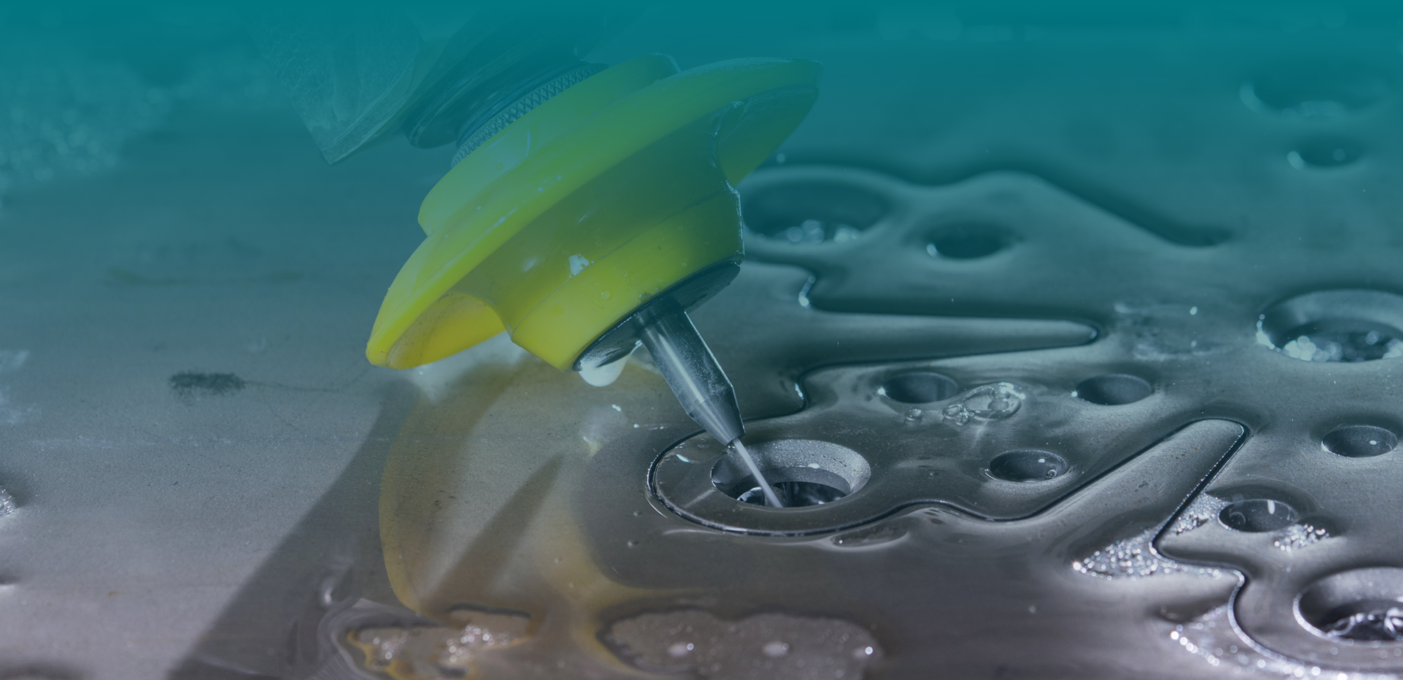 someone sitting at a computer with their hand on the mouse with a blurry monitor in the background