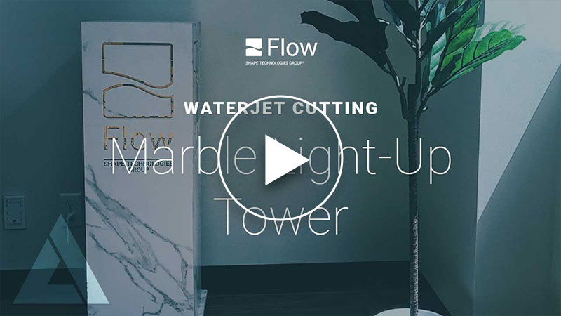 Marble light-up tower with Flow Waterjet logo cut into it