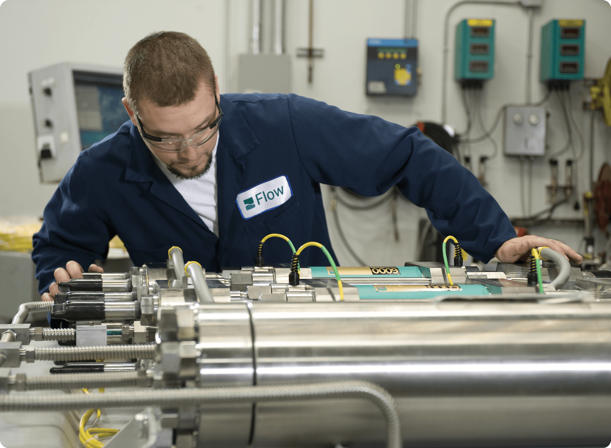 FlowCare service technician working on an intensifier pump