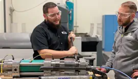 Trainer and Trainee learning about waterjet technology. 